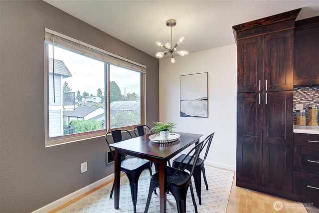 a view of a dining room with furniture window and outside view