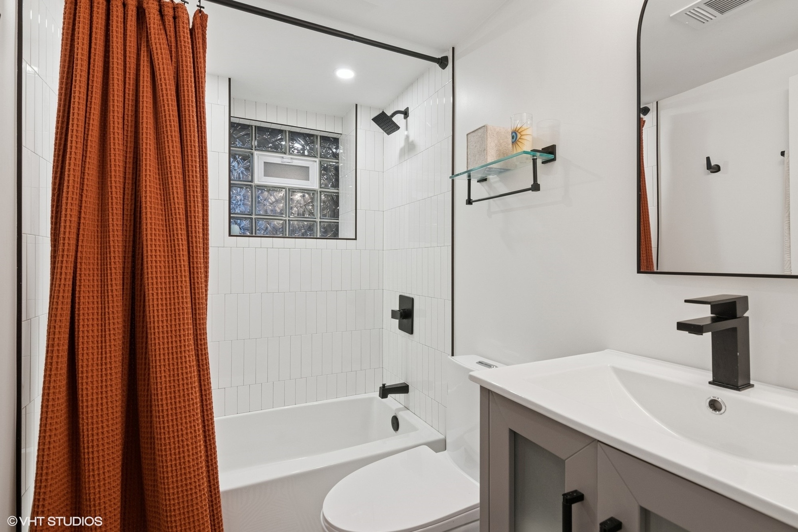 1650 West Rascher Avenue, Unit 1W Chicago, IL 60640 - Photo 14 of 19 a bathroom with a sink a toilet and shower