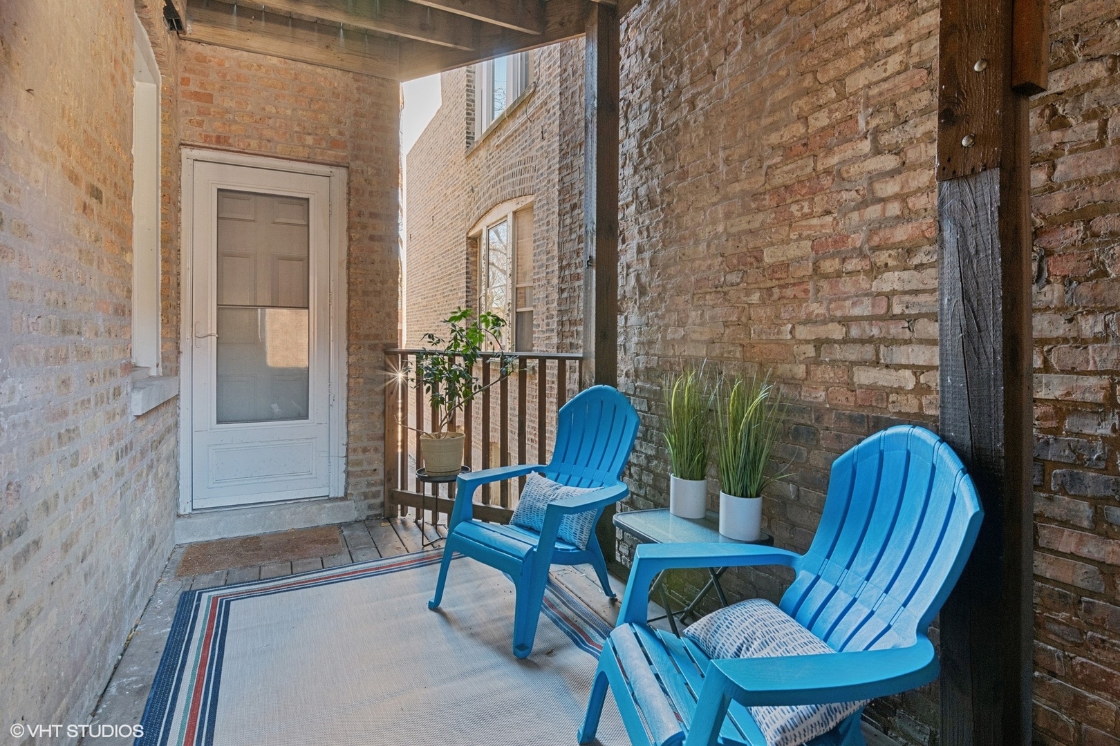 1650 West Rascher Avenue, Unit 1W Chicago, IL 60640 - Photo 16 of 19 a view of a porch with furniture and a yard
