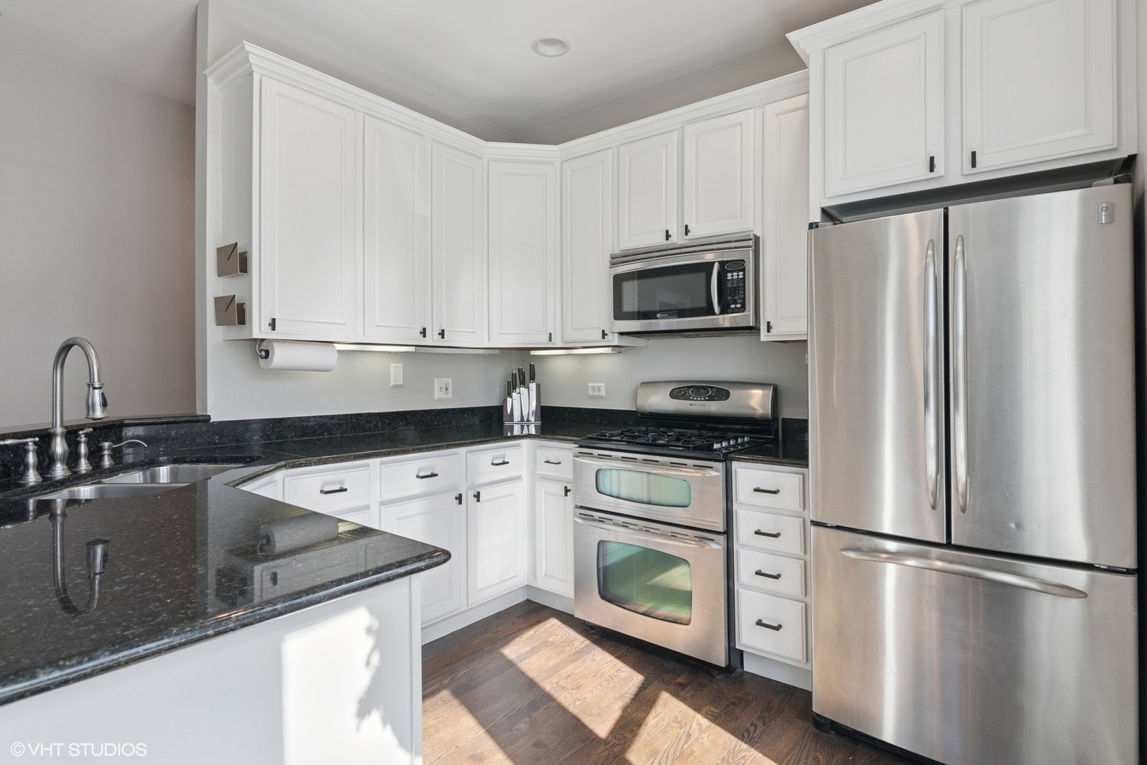 1650 West Rascher Avenue, Unit 1W Chicago, IL 60640 - Photo 4 of 19 a kitchen with stainless steel appliances granite countertop a refrigerator sink and stove
