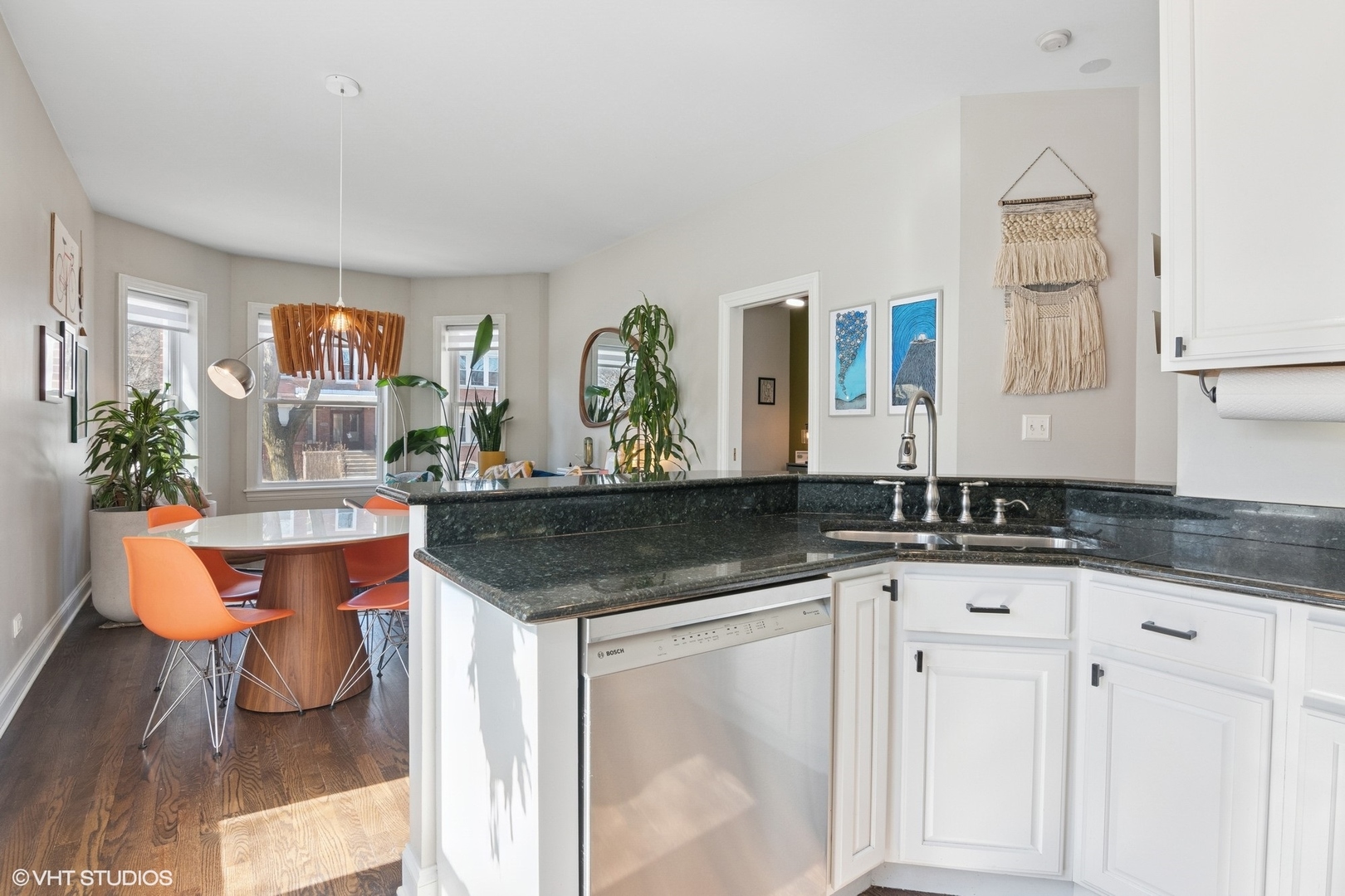 1650 West Rascher Avenue, Unit 1W Chicago, IL 60640 - Photo 5 of 19 a kitchen with granite countertop a sink and a white cabinets