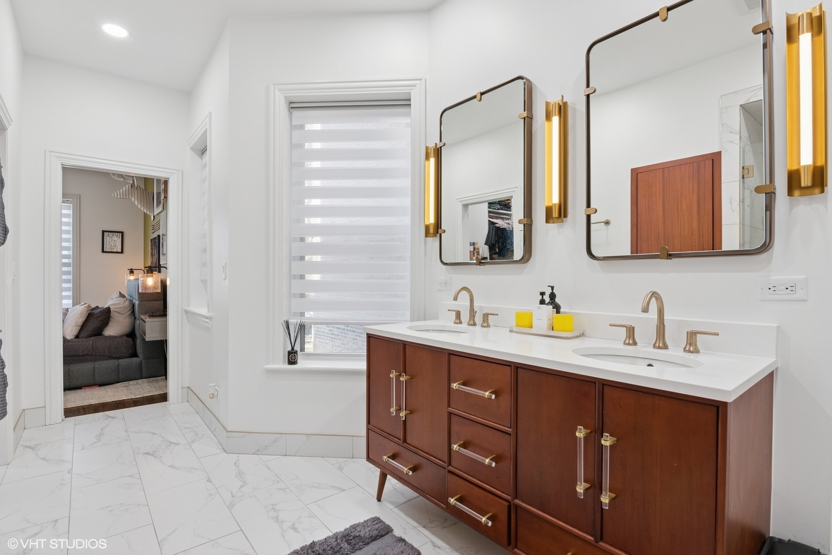 1650 West Rascher Avenue, Unit 1W Chicago, IL 60640 - Photo 7 of 19 a spacious bathroom with a double vanity sink a mirror and next to a window