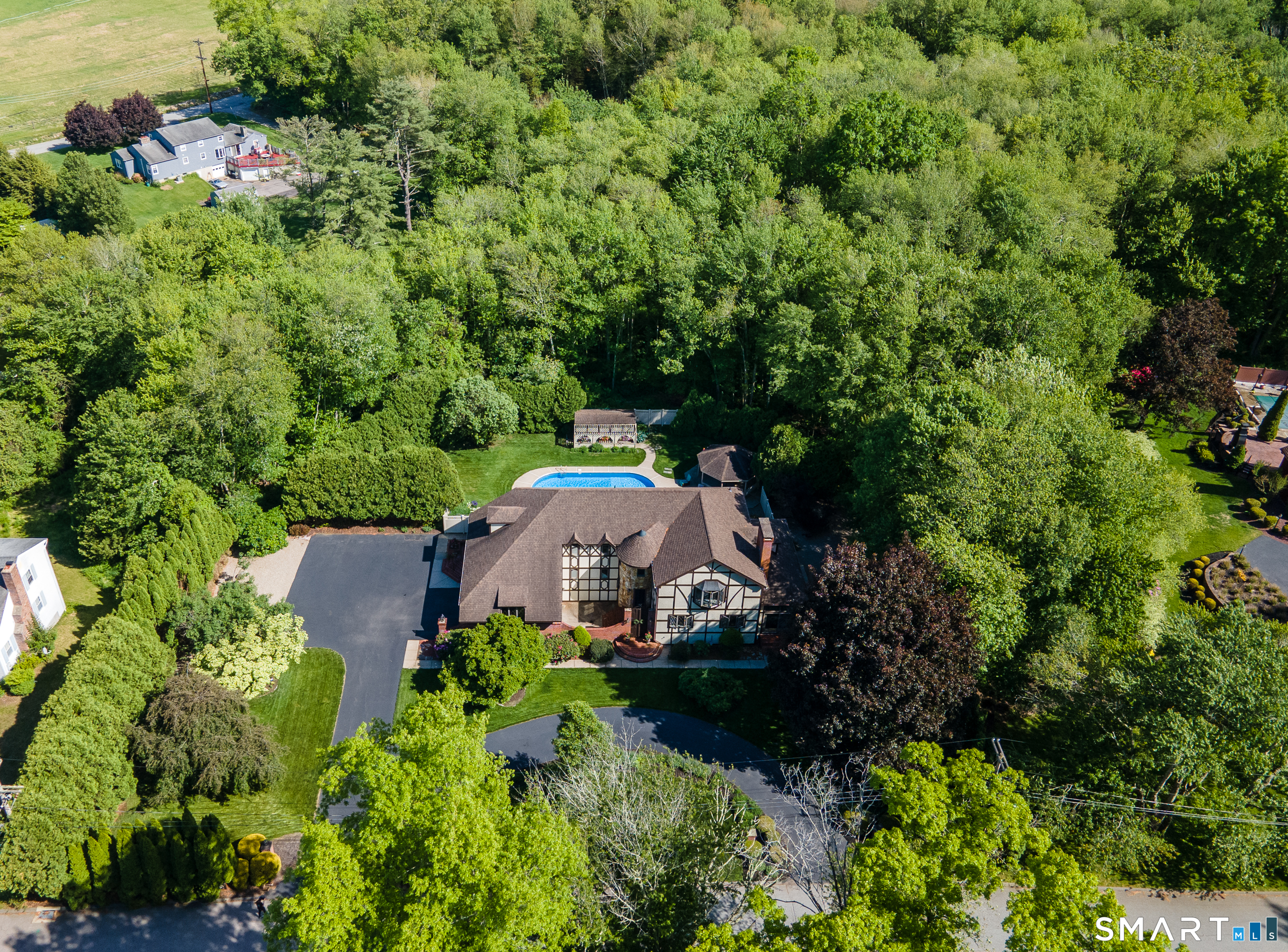 25 Stony Ridge Road Norwich, CT 06360 - Photo 1 of 40 an aerial view of a house with a garden and lake view