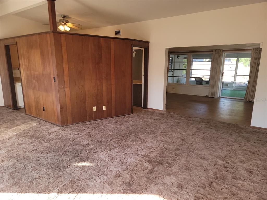 259 Gardenia Road Venice, FL 34293 - Photo 4 of 6 wooden floor and windows in an empty room