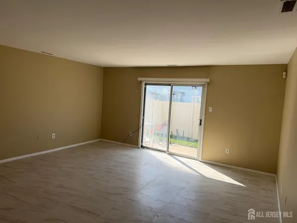 an empty room with sliding door