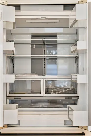 a large kitchen with a table and chairs