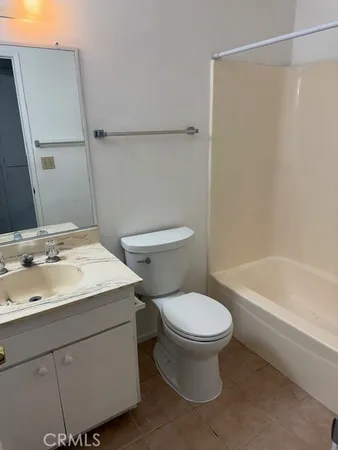 a bathroom with a sink a toilet and a bathtub
