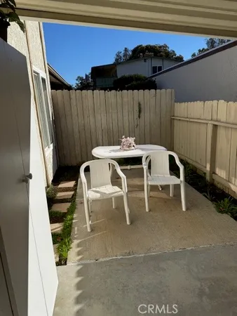 a patio with table and chairs