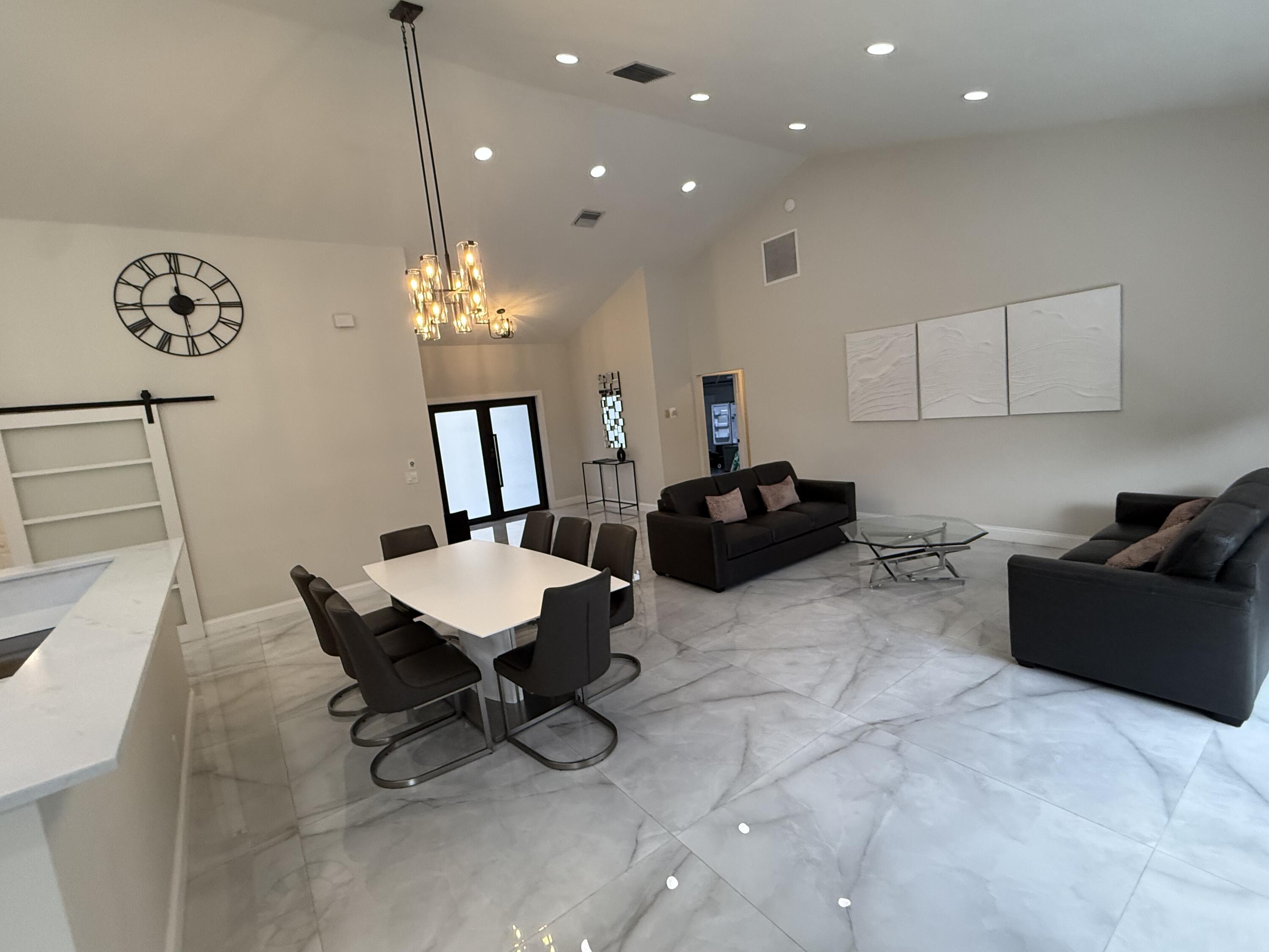 9629 El Clair Ranch Road Boynton Beach, FL 33437 - Photo 9 of 24 the dining and living areas