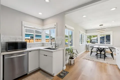 a kitchen with sink and microwave