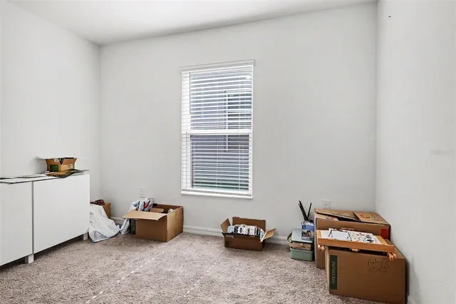 a bedroom with furniture and a window