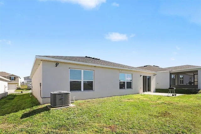 a view of a house with backyard porch and garden