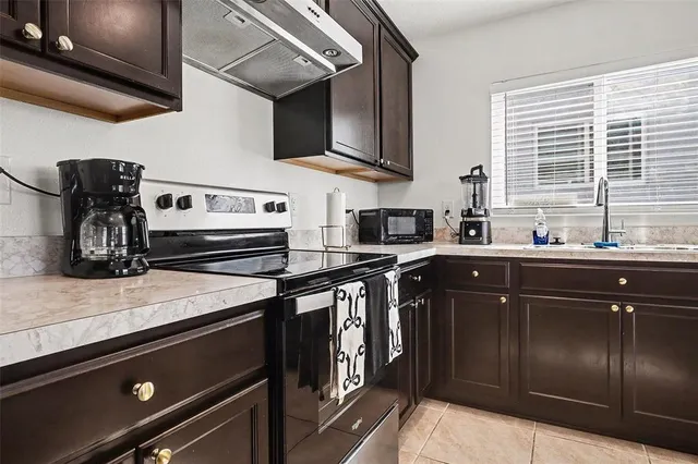 a kitchen with a sink and cabinets