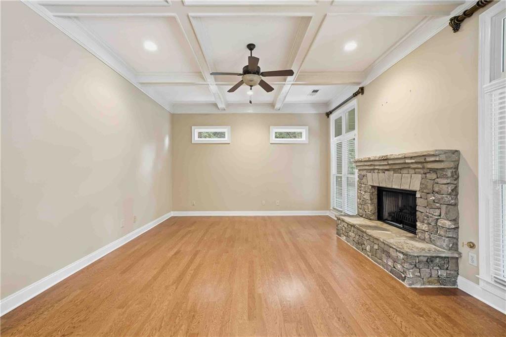4055 Hill House Road Southwest Smyrna, GA 30082 - Photo 11 of 50 wooden floor in an empty room with a fireplace