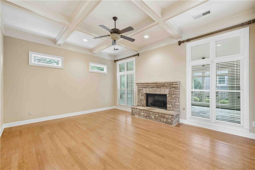4055 Hill House Road Southwest Smyrna, GA 30082 - Photo 12 of 50 a view of an empty room with a fireplace and a window