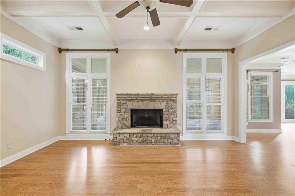 4055 Hill House Road Southwest Smyrna, GA 30082 - Photo 13 of 50 a living room with a fireplace with wooden floor