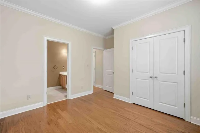 a view of a room with wooden floor