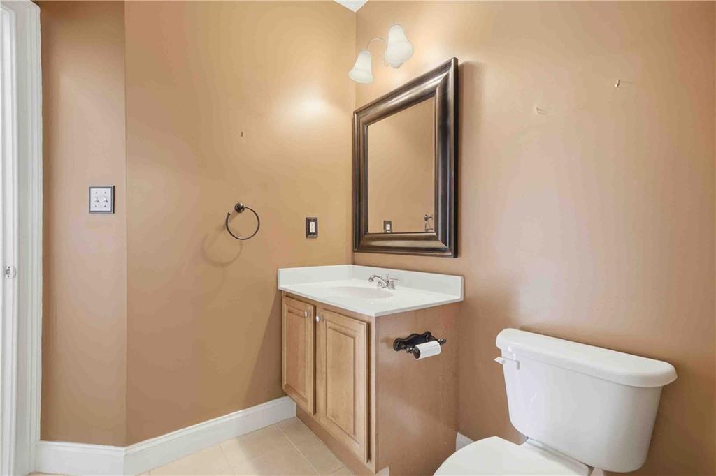 4055 Hill House Road Southwest Smyrna, GA 30082 - Photo 20 of 50 a bathroom with a toilet sink and mirror