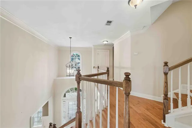 a view of a hallway with windows