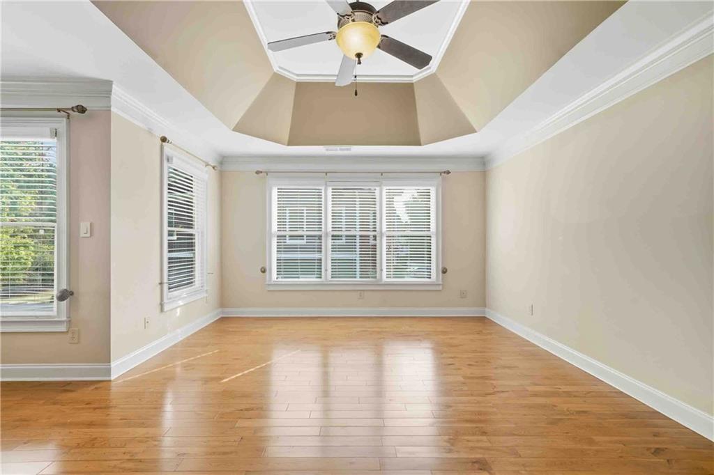 4055 Hill House Road Southwest Smyrna, GA 30082 - Photo 24 of 50 a view of an empty room with wooden floor and a window