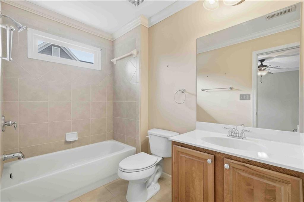 4055 Hill House Road Southwest Smyrna, GA 30082 - Photo 31 of 50 a bathroom with a sink a toilet and shower