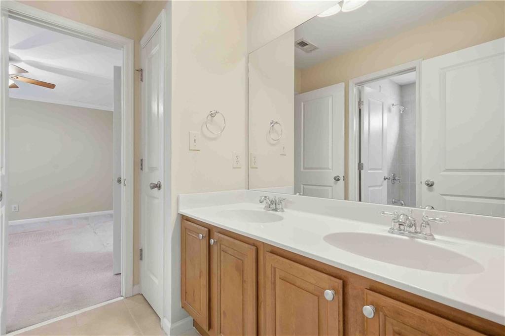 4055 Hill House Road Southwest Smyrna, GA 30082 - Photo 34 of 50 a bathroom with a sink double vanity and a mirror