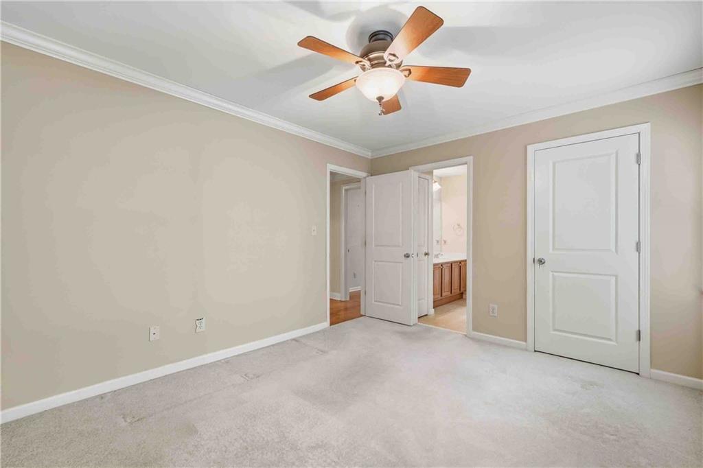 4055 Hill House Road Southwest Smyrna, GA 30082 - Photo 37 of 50 an empty room with closet and fan