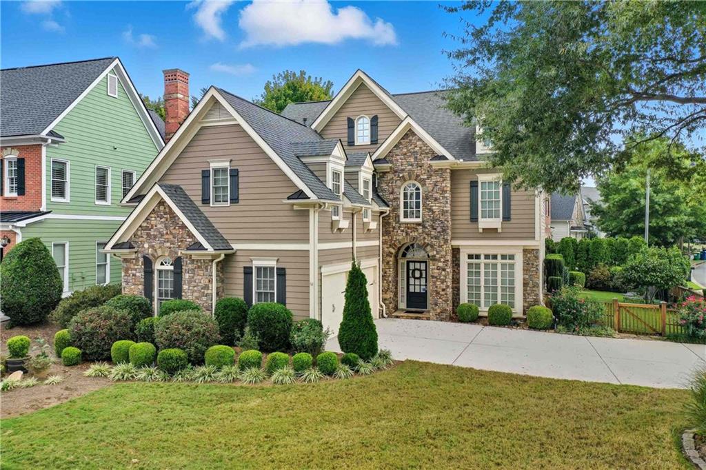 4055 Hill House Road Southwest Smyrna, GA 30082 - Photo 42 of 50 a front view of a house with a yard