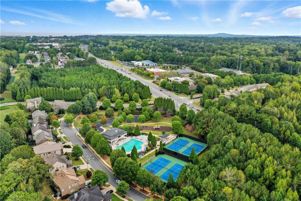 4055 Hill House Road Southwest Smyrna, GA 30082 - Photo 46 of 50 an aerial view of residential houses with outdoor space and trees