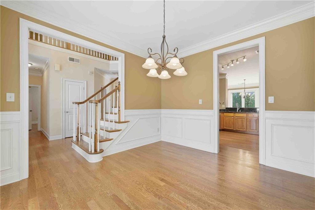 4055 Hill House Road Southwest Smyrna, GA 30082 - Photo 5 of 50 a view of a livingroom with wooden floor and stairs