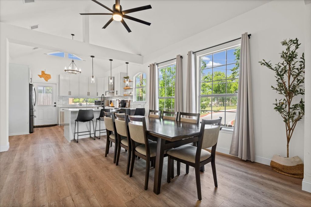 1201 Garden Street, Unit A Austin, TX 78702 - Photo 7 of 30 Open-concept living area featuring wood-finish flooring, vaulted ceilings, and a contemporary ceiling fan