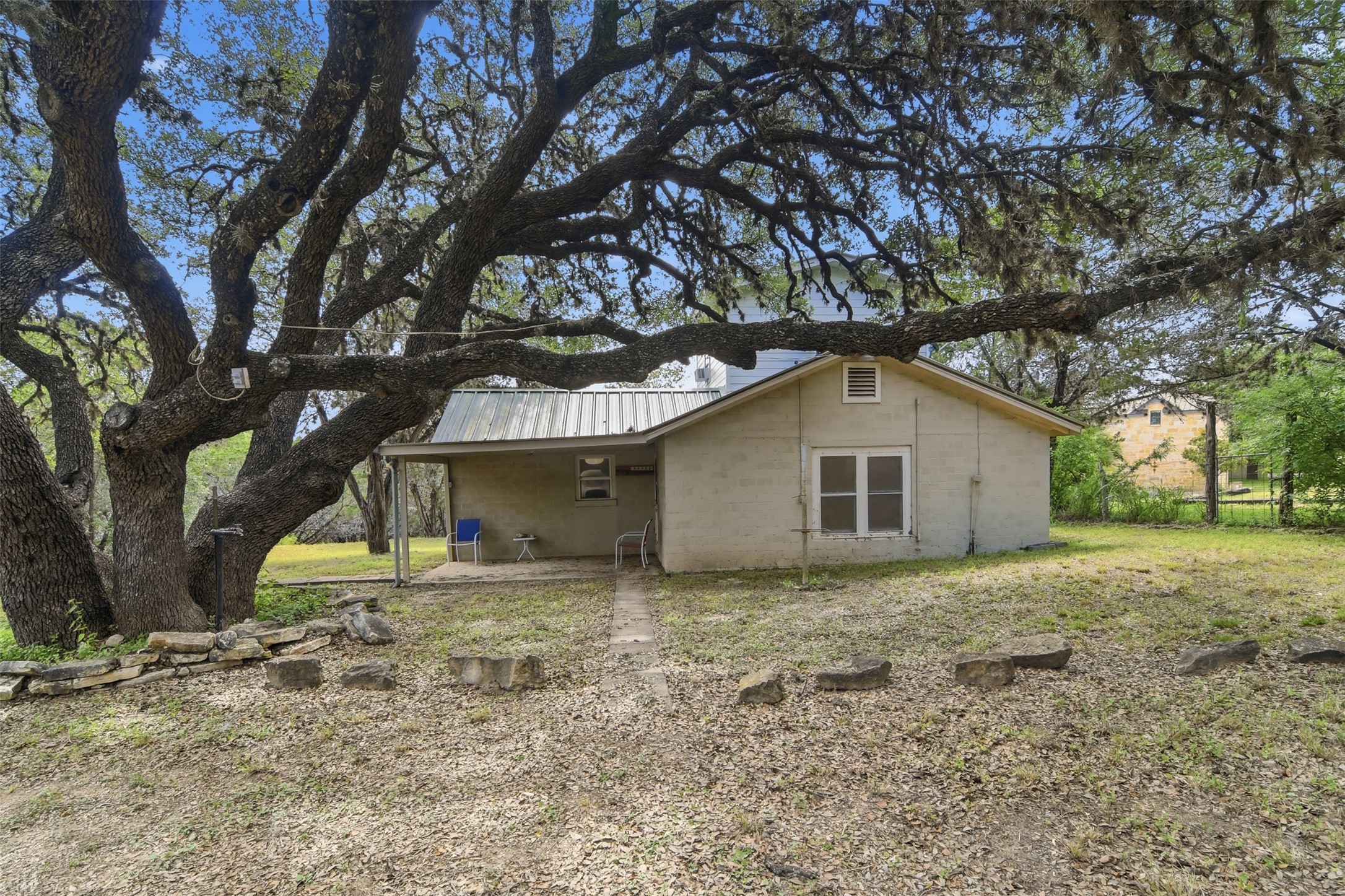 1260 Magers Road Concan, TX 78838 - Photo 7 of 40 Mature trees shade this charming residence with a covered front porch.