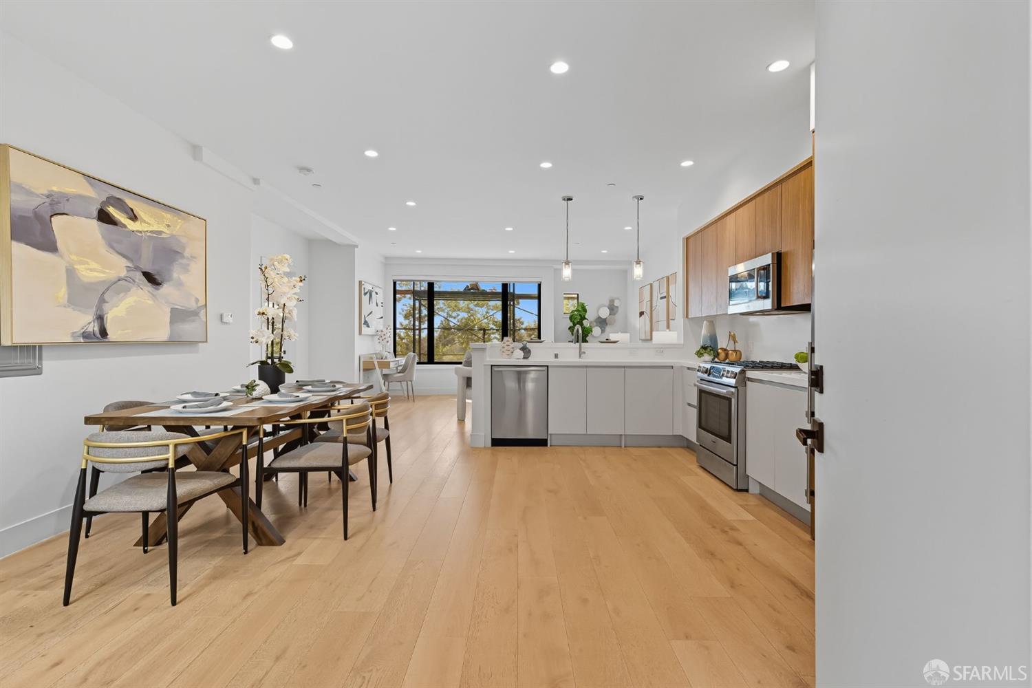 2747 San Pablo Avenue, Unit 406 Berkeley, CA 94702 - Photo 1 of 34 a kitchen with a table and chairs in it