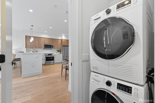 a view of a kitchen with washer and dryer