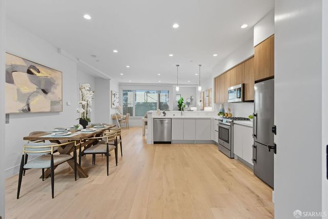 a kitchen with a table and chairs in it