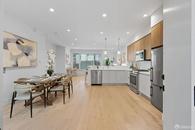 a kitchen with a table and chairs in it