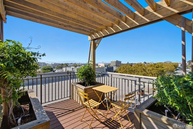 a view of a chairs on wooden deck