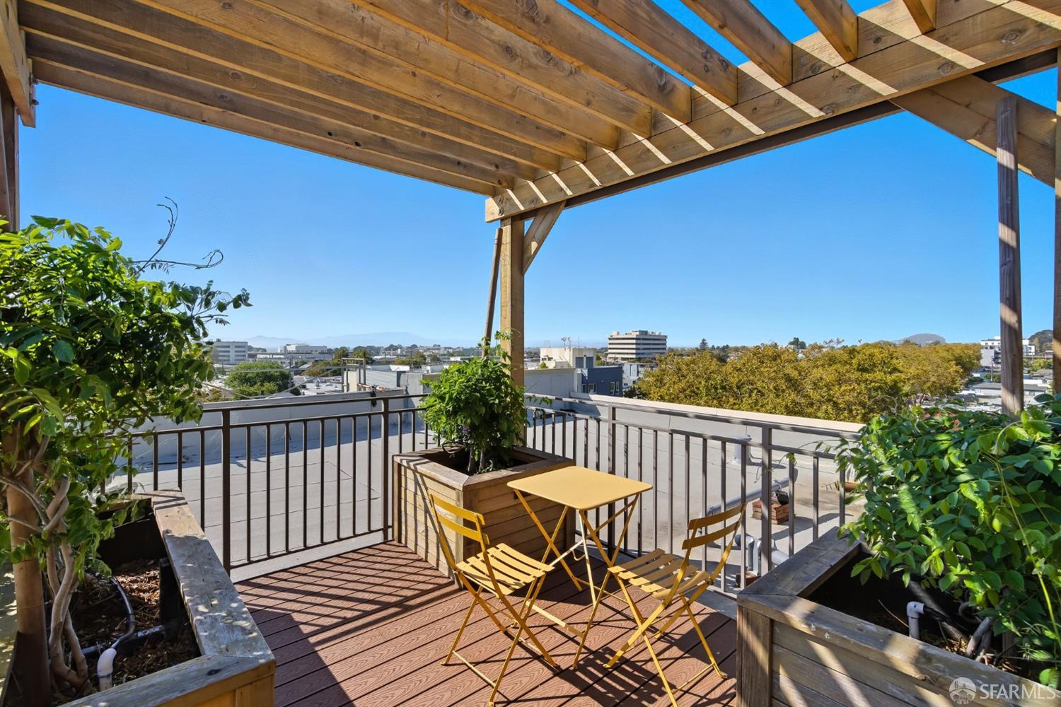 2747 San Pablo Avenue, Unit 406 Berkeley, CA 94702 - Photo 28 of 34 a view of a chairs on wooden deck