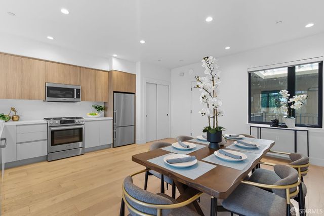 a kitchen with a table and chairs in it
