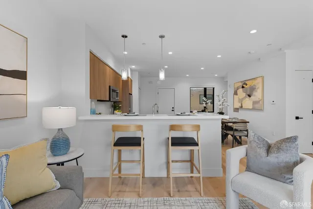 a view of kitchen with cabinets and wooden floor