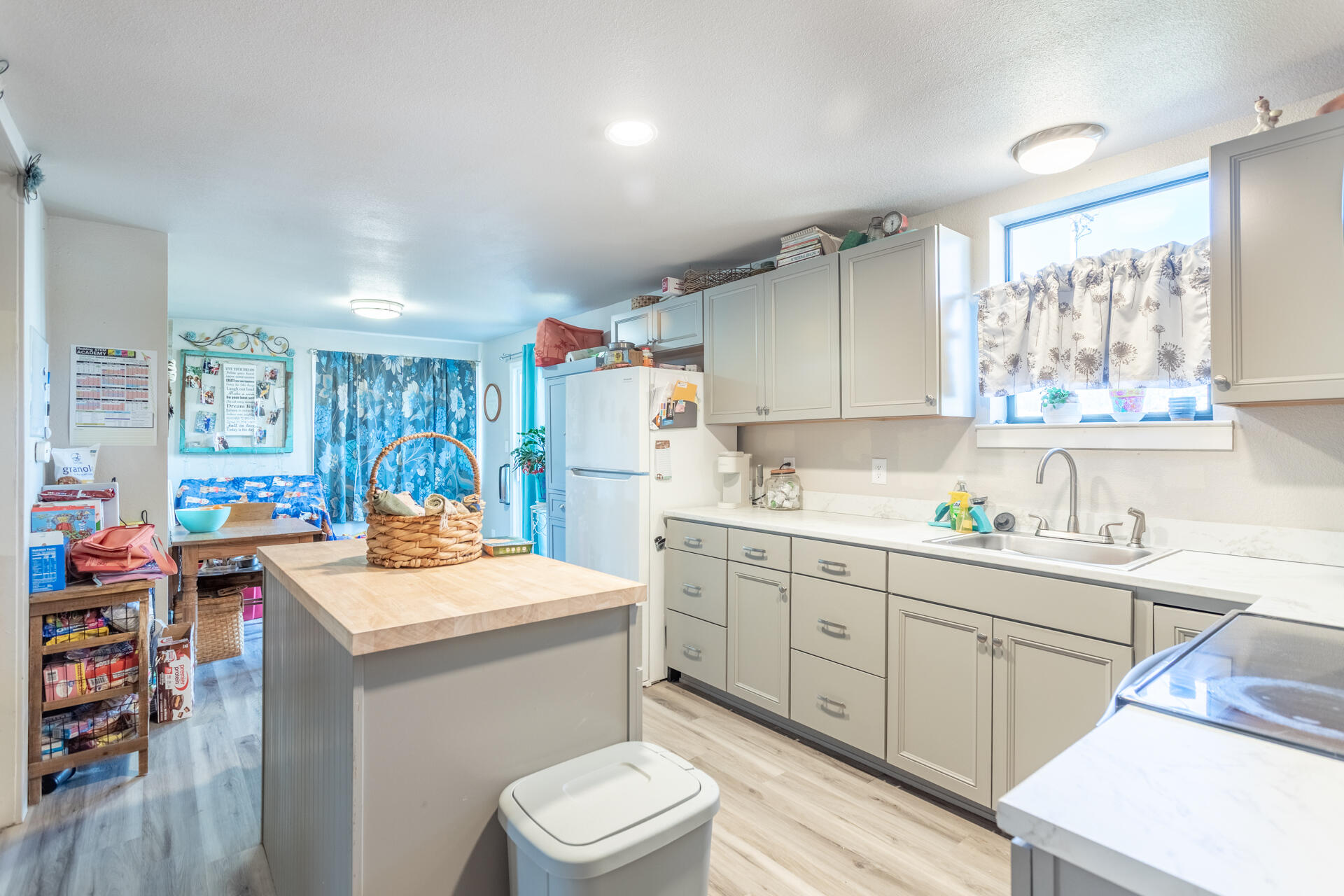 1012 State Street Redding, CA 96001 - Photo 16 of 27 a kitchen with a sink a stove and cabinets
