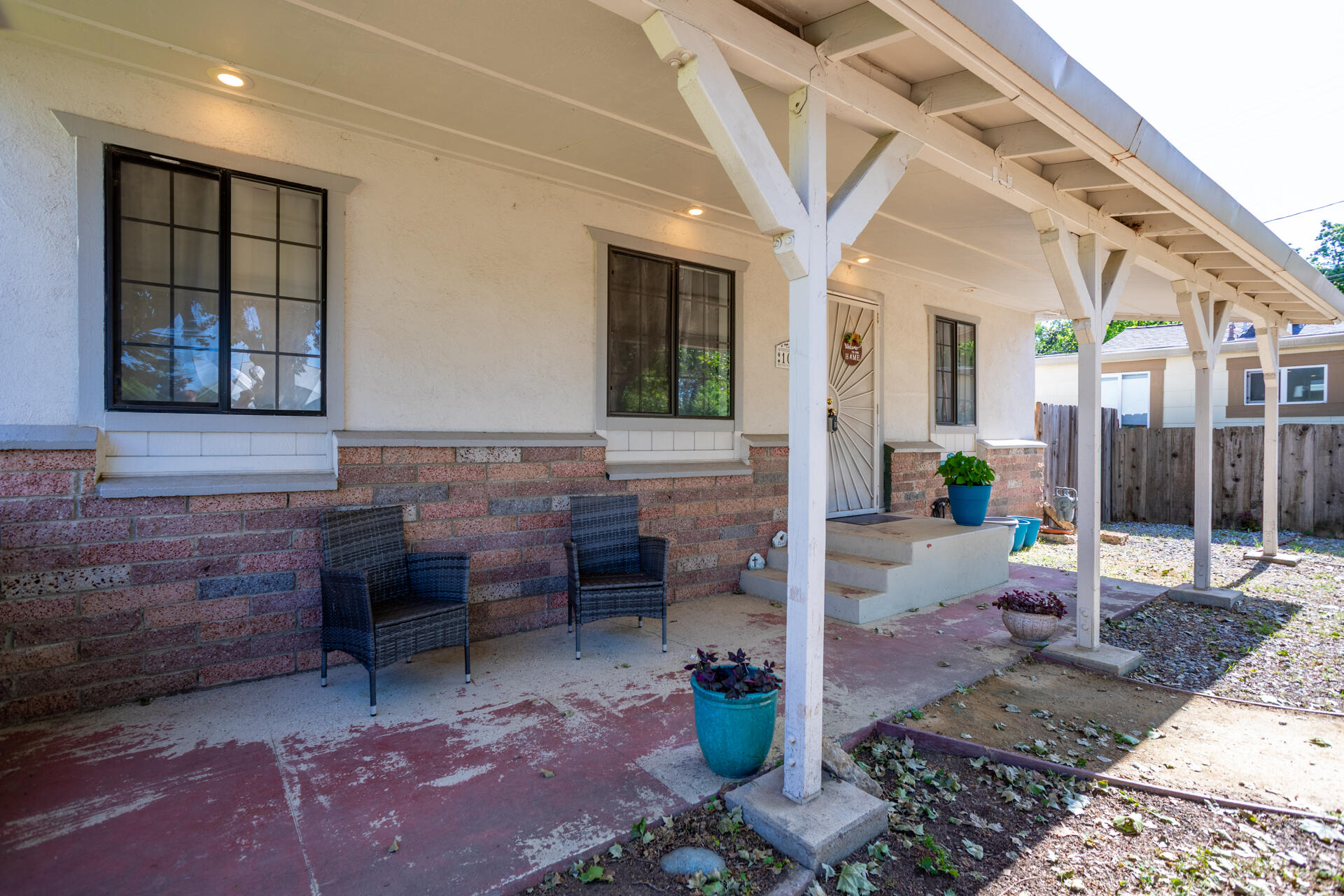 1012 State Street Redding, CA 96001 - Photo 7 of 27 a building outdoor space with patio furniture and potted plants
