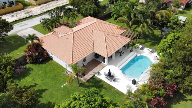 an aerial view of house with yard