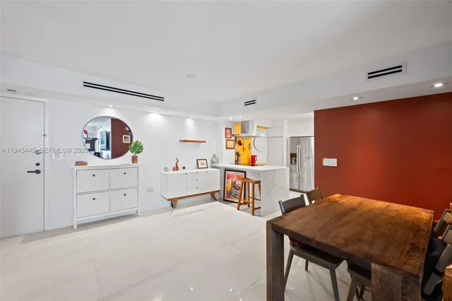 a bedroom with furniture and window