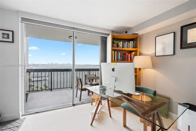 a workspace with furniture and window