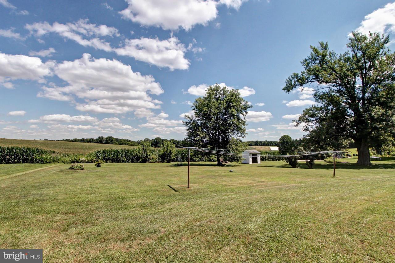 15905 Trenton Road Upperco, MD 21155 - Photo 22 of 25 a view of a lake with houses in the back