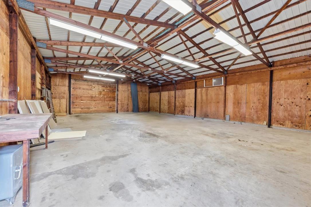 2412 Clearview Road Coplay, PA 18037 - Photo 38 of 53 Exposed wood trusses overhead frame a spacious interior with durable concrete flooring.