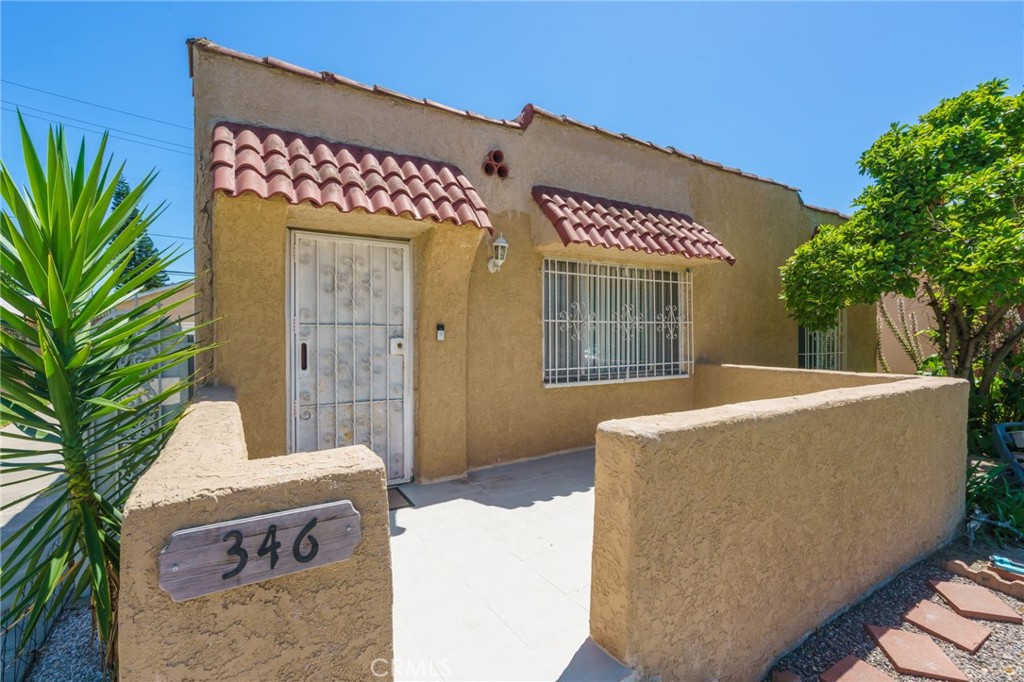 346 West School Street Compton, CA 90220 - Photo 3 of 29 a view of a house with a tub and potted plants