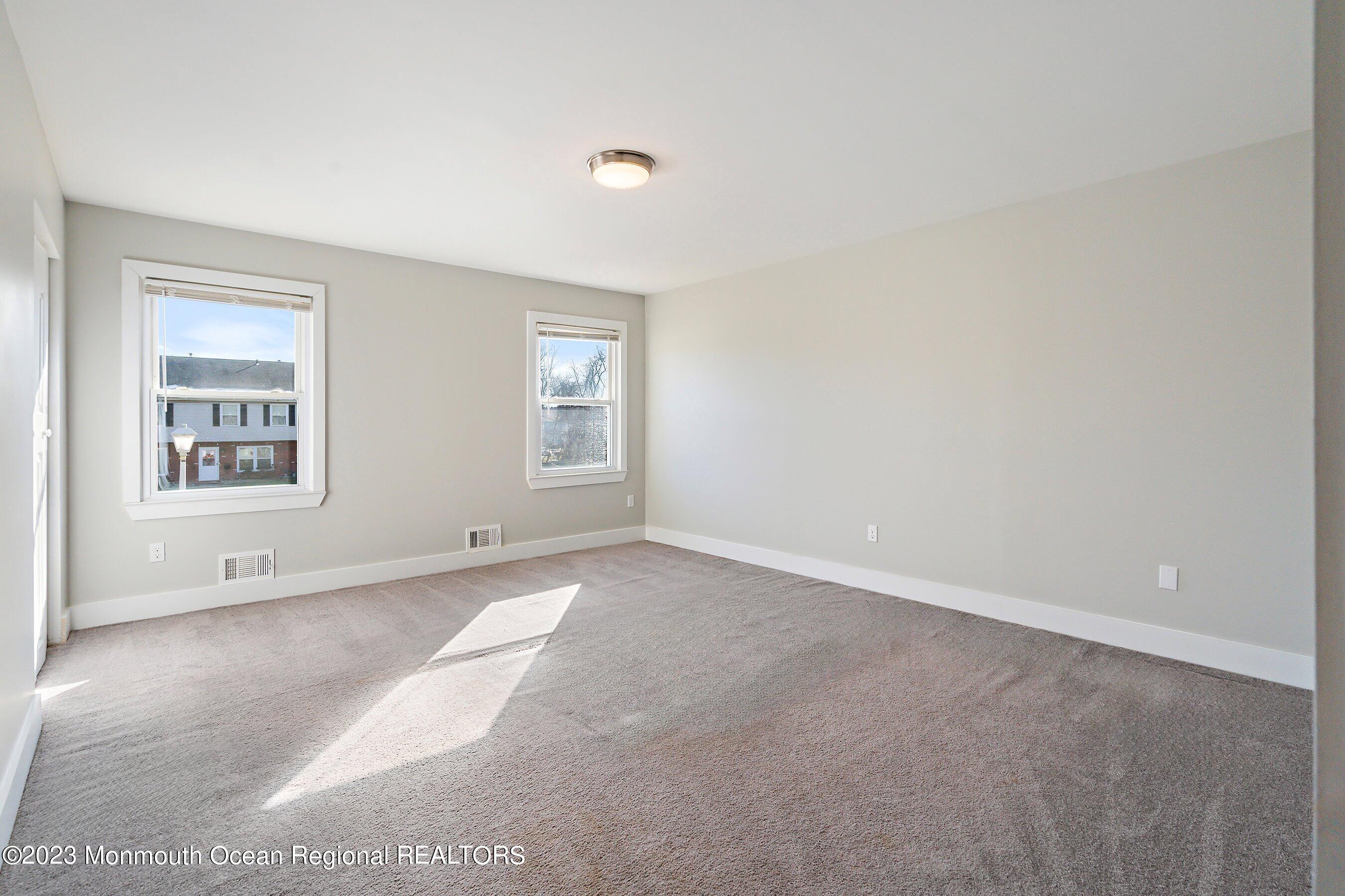 1012 Sawmill Road, Unit 6 Brick, NJ 08724 - Photo 19 of 24 an empty room with windows