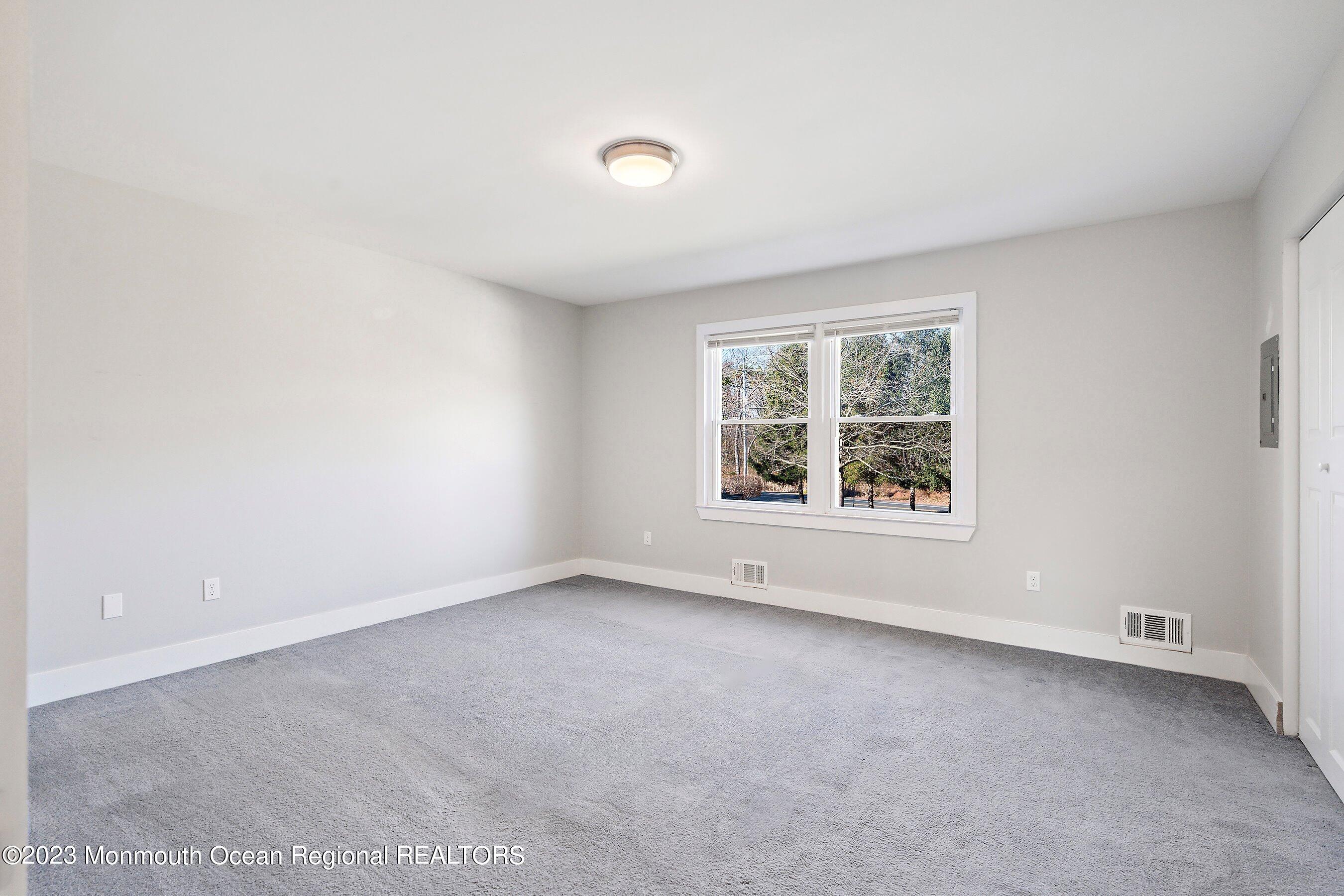 1012 Sawmill Road, Unit 6 Brick, NJ 08724 - Photo 20 of 24 an empty room with a window